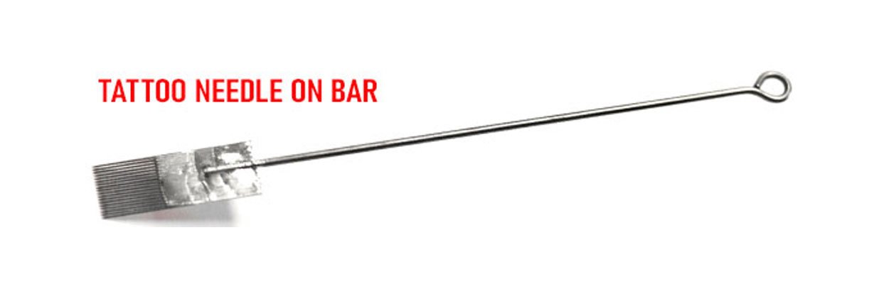 Close-up of a tattoo needle on bar with soldered steel needles for precision tattooing.