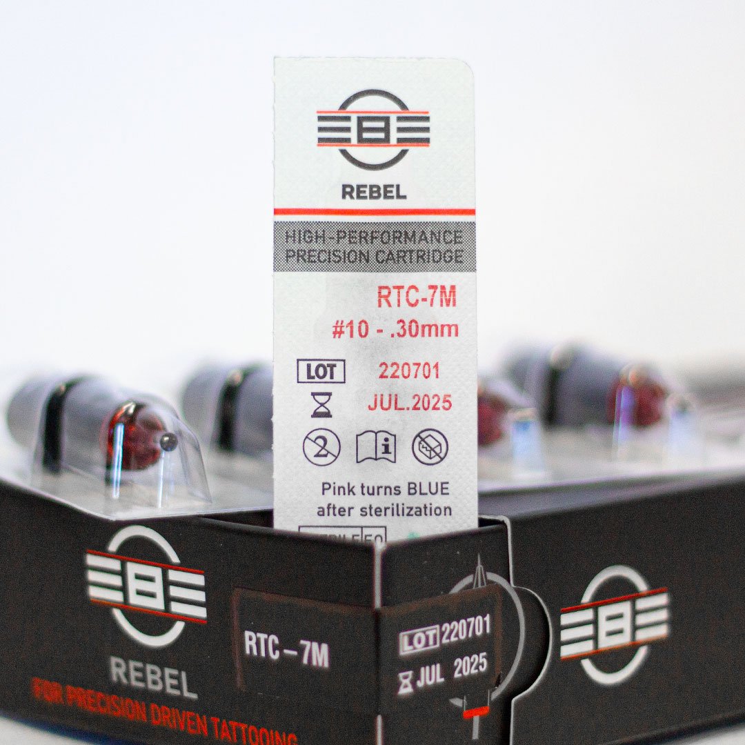 REBEL 7 Magnum tattoo needle retail box with open drawer, cartridge and blister pack showing RTC coding, gauge, and details