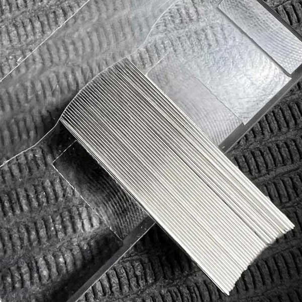 Tattoo needle jig used for aligning stainless steel needles in curved magnum configuration manufacturing
