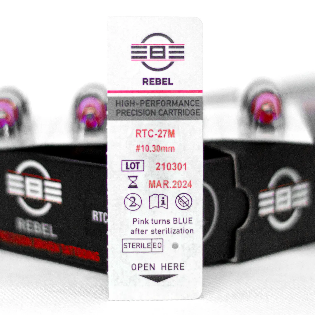 REBEL 27 Magnum tattoo needle retail box with open drawer, cartridge and blister pack showing RTC coding, gauge, and details