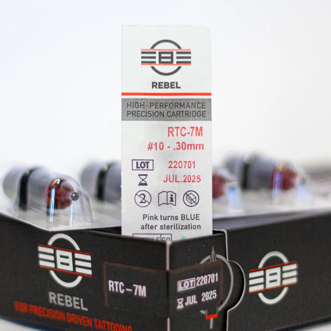 REBEL 7 Magnum tattoo needle retail box with open drawer, cartridge and blister pack showing RTC coding, gauge, and details