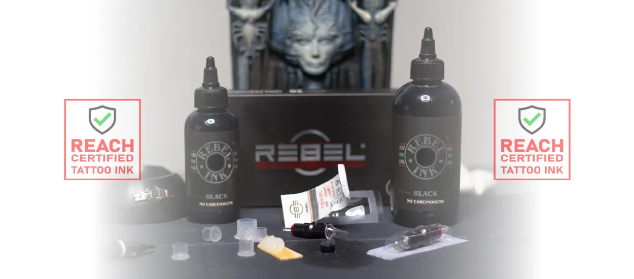 REBEL REACH-certified black tattoo ink bottles with packaging and cartridges, clean studio setup, deep black professional tattoo ink