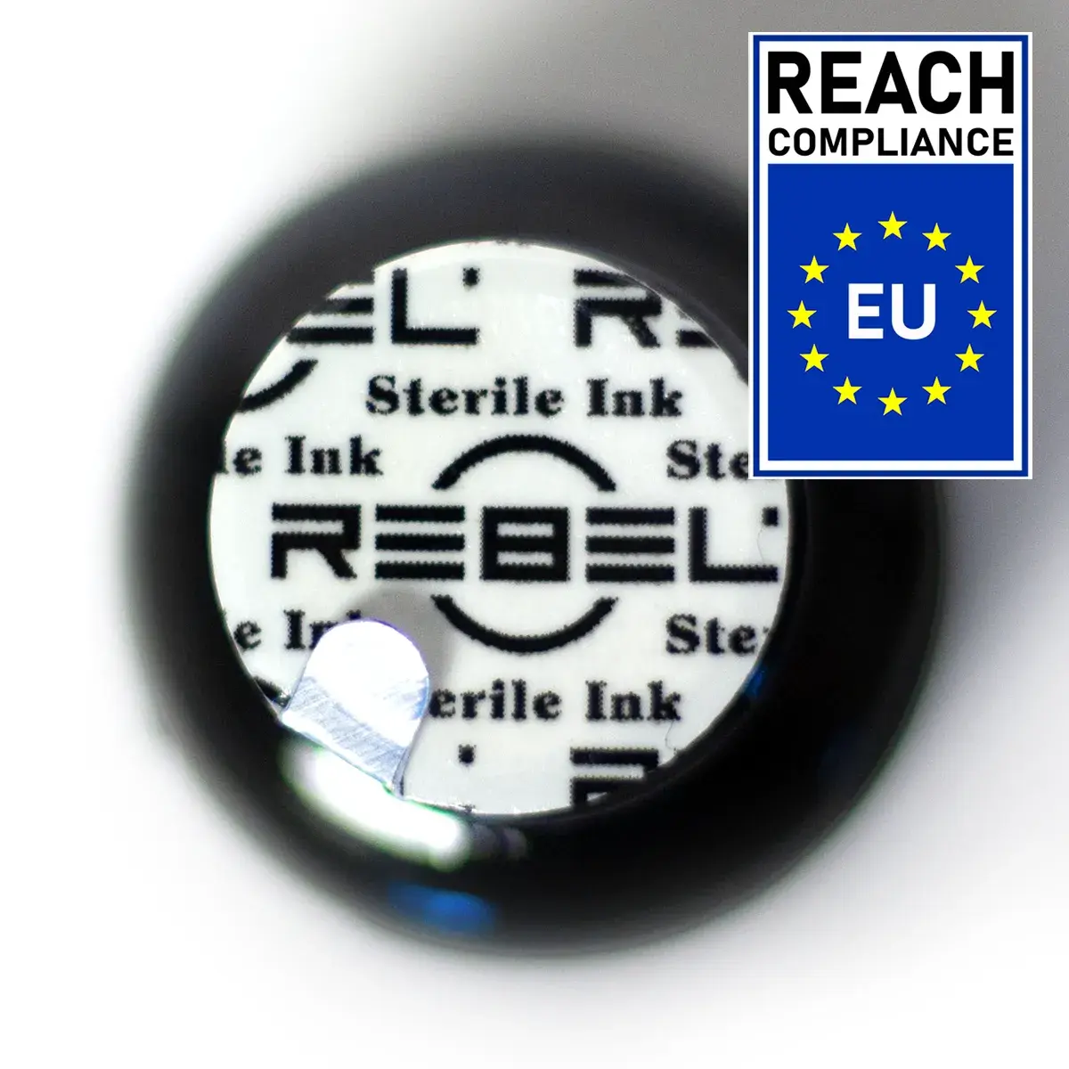 REBEL custom-printed induction seal and innovative pull-tab on a REACH compliant ink bottle