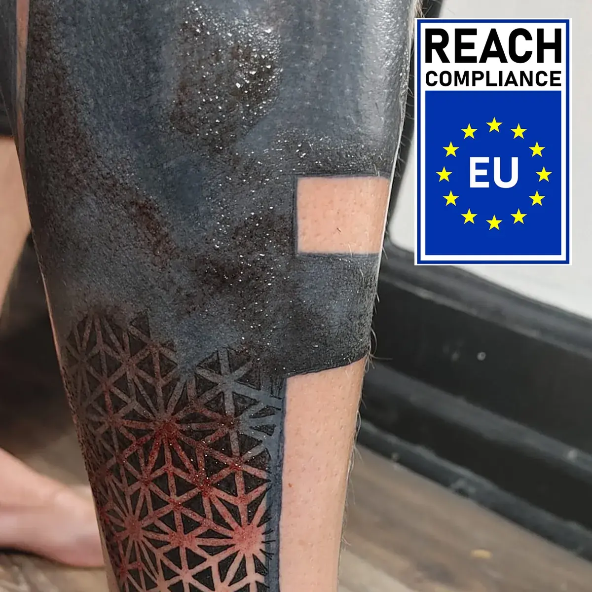 Partially fresh geometric blackwork tattoo showcasing REBEL Black REACH compliant ink saturation.