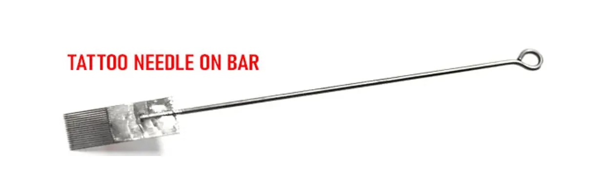 Close-up of a tattoo needle on bar with soldered steel needles for precision tattooing.