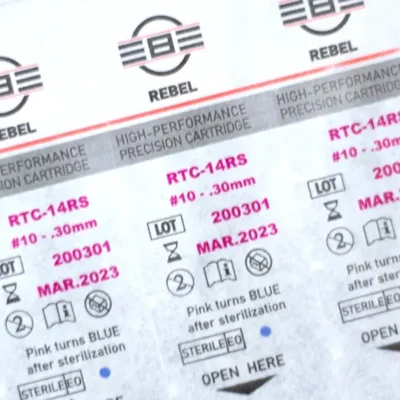 REBEL Precision 14RS round shader tattoo cartridge blister pack showing RTC code, gauge #10 0.30mm, lot number and sterilization details