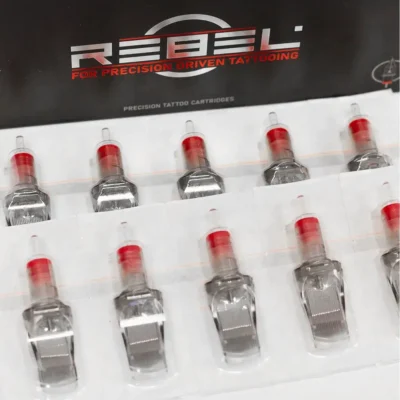 REBEL Precision Curved Magnum tattoo cartridges arranged in sterile blister tray packaging inside branded box