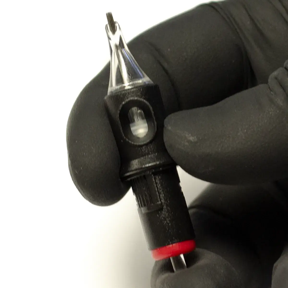 REBEL Precision Round Shader tattoo cartridge showing silicone membrane flex to expose needle tip