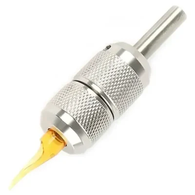 Steel knurled tattoo grip with yellow disposable plastic tip — hybrid assembly bridging reusable steel and fully disposable setups