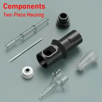 Tattoo cartridge components exploded view with two-piece black housing, plunger, membrane cap, and needle head