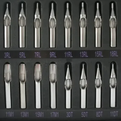 Vintage steel tattoo tips in round liner, magnum, and flat shader configurations — 3RL through 18RL, 11M1 through 17M1, and 3DT through 11DT — standard professional setup before disposable cartridges