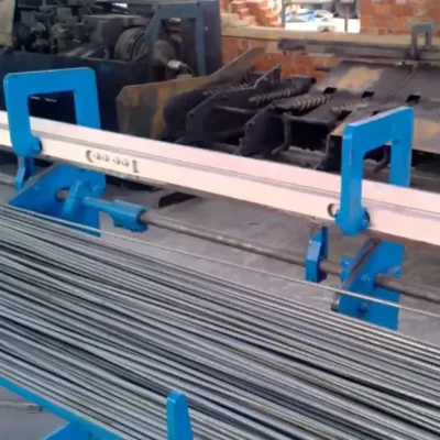 Industrial wire straightening and cutting machine producing uniform steel rod sections — the blunt blanks before tattoo needle tapering begins