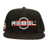 Front view of the REBEL snapback hat featuring a 4.5" wide centered red-and-white 3D embroidered logo on solid black front panels, with a partial view of a small red-and-white 1.5" embroidery above the right ear and a flat brim.
