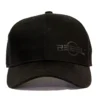 REBEL Phantom Trucker Hat front view, raised black rubber REBEL logo off-center on structured cotton panel, curved visor