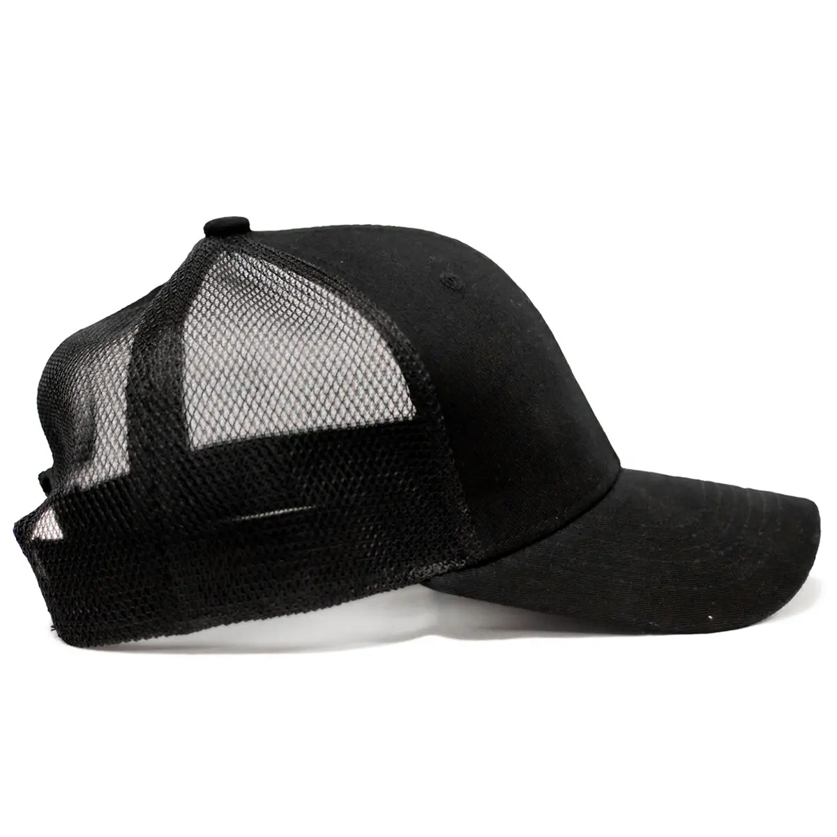 REBEL Phantom Trucker Hat right side view, clean black cotton panel and curved visor, black mesh back visible