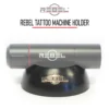 REBEL tattoo machine holder, grey machine grip resting in matte black stand, engraved REBEL logo