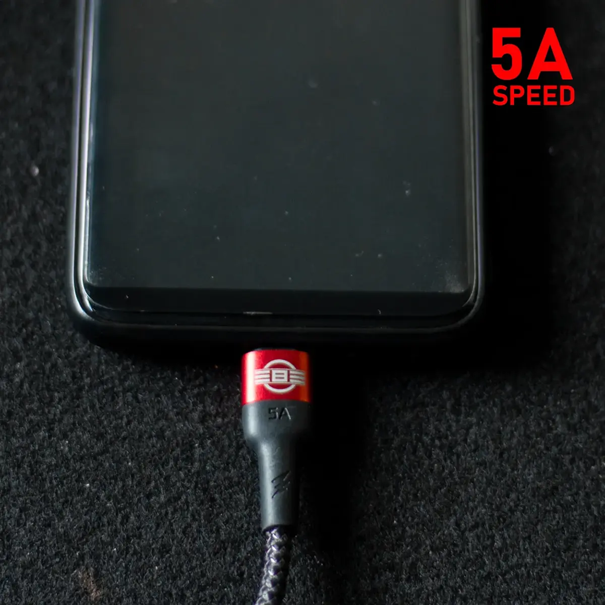 REBEL 5A USB-C charging cable plugged into a smartphone