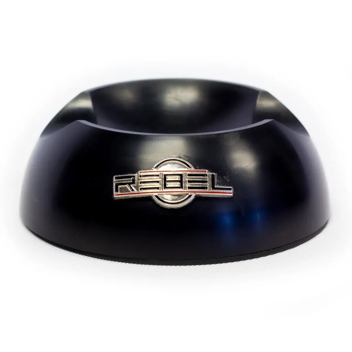 Black tattoo machine holder base with silver REBEL badge, angled front view