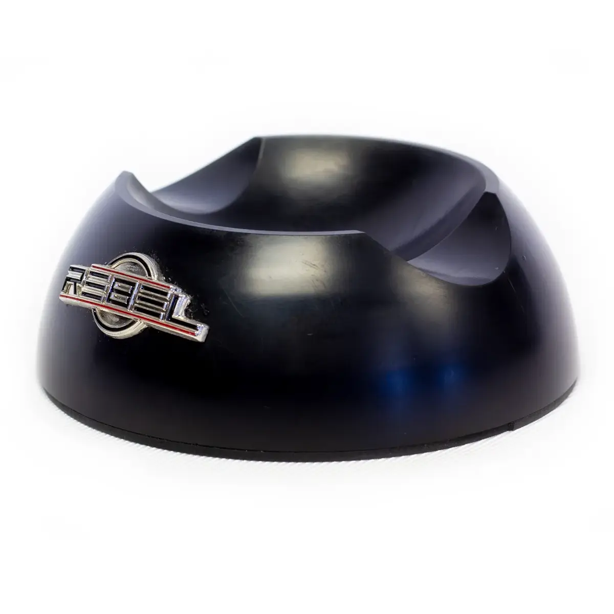 Tattoo machine holder base, side angle showing cradle notch and REBEL badge